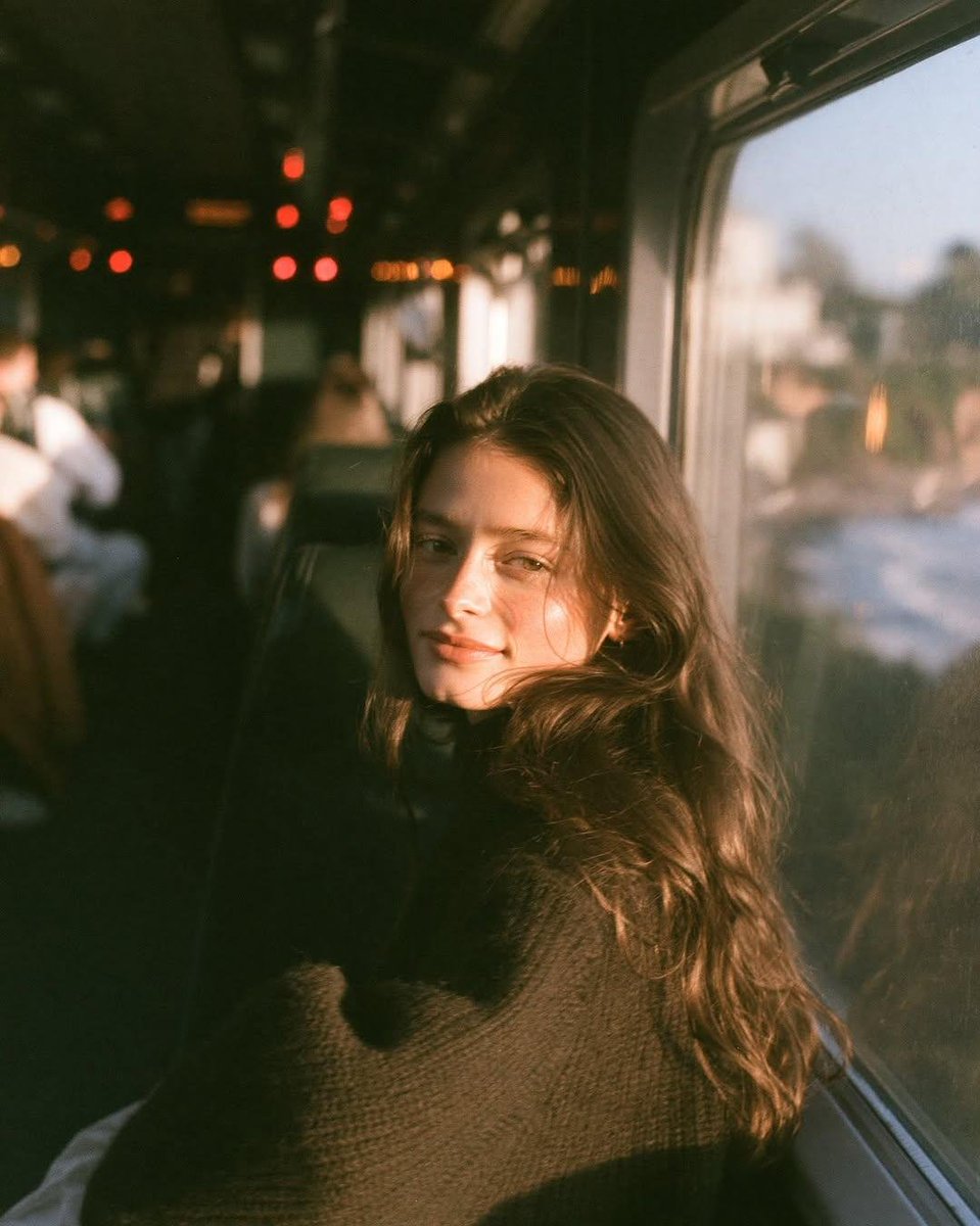 Golden Hour Portrait by the Train Window