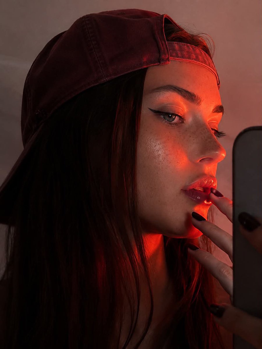 Profile Selfie Portrait with Red-Orange Rim Lighting